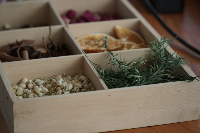 A wooden box filled with different types of food